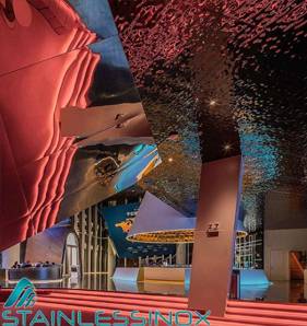 Spacious restaurant interior with high ceiling, elegant decor, and cozy ambiance