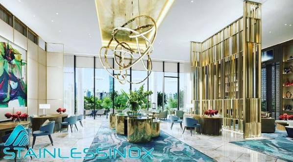 Opulent hotel lobby with grand chandelier, elegant decor, and plush furnishings