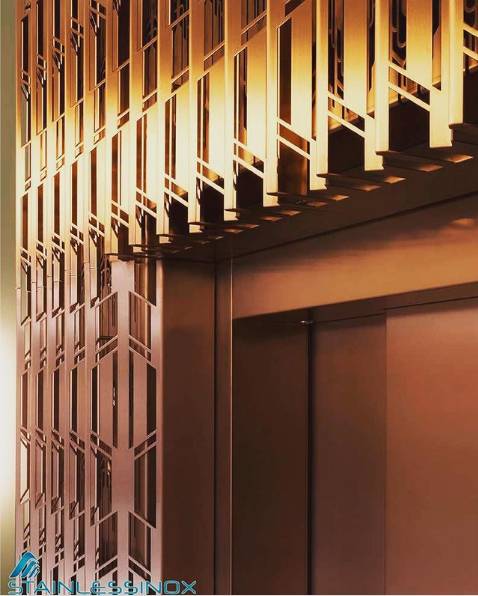 A modern metal wall with a decorative pattern